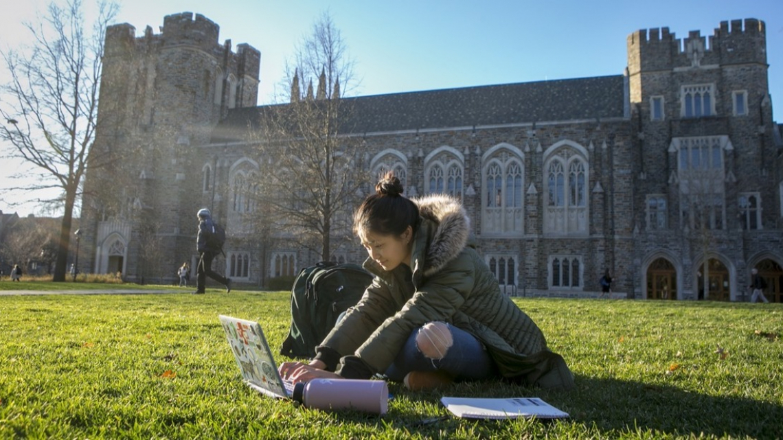 Image of student on the quad outside of Rubenstein Library