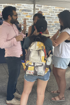 Prof. D'Alessandro chatting with students