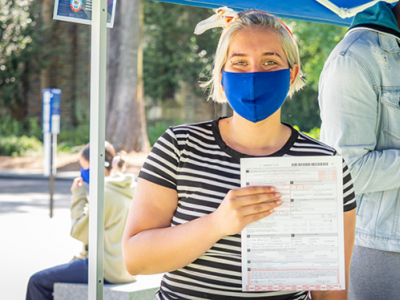 Photo of Duke Undergraduate Alicia Medina registering to vote