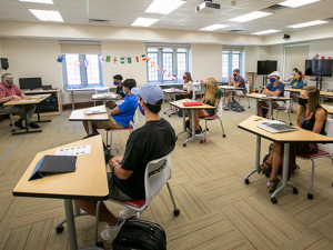 Professor Michael Newcity leads a FOCUS class in a room where the students have been set apart.
