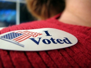 Photo of "I Voted" sticker with US Flag