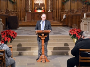 Artie Hendricks, clinical chaplain of palliative care and bereavement services, reads the names of employees who have passed away during the Staff Memorial Service in 2019. Photo by Jonathan Black.