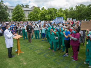 Photo of Dr. Eugene Washington speaks to the participants prior to the solidarity march