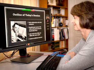 Photo by Dennis Szerszen of Kate Szerszen watches Alan Teasley’s online class about Stephen Sondheim. 
