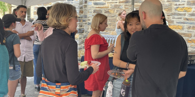 Faculty and students discussing