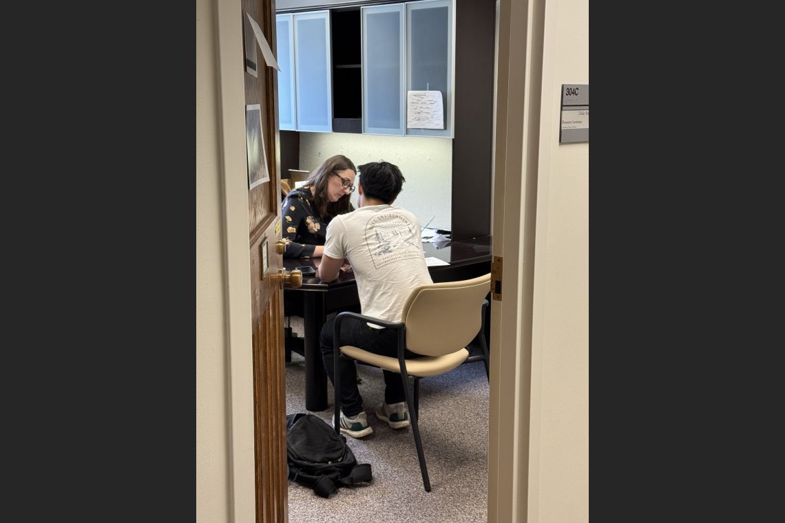 Professor Frances Leviston, Blackburn Artist-in-Residence chatting with student