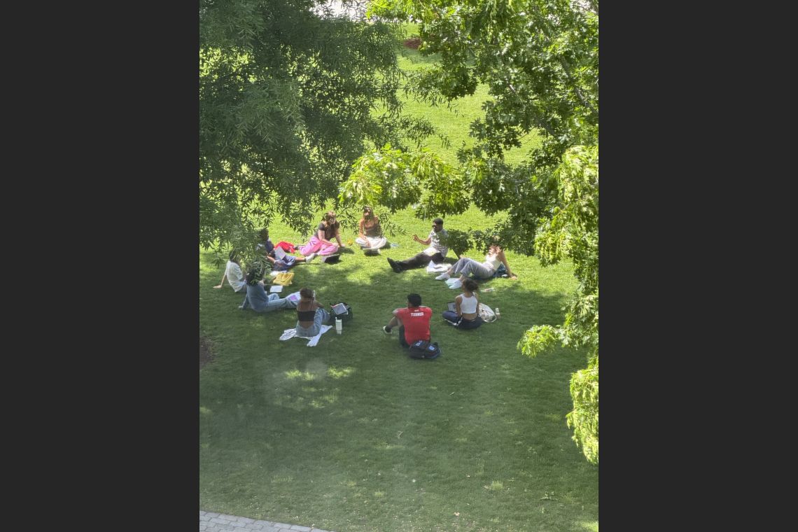 Professor Jarvis McInnis having class on the Abele Quad